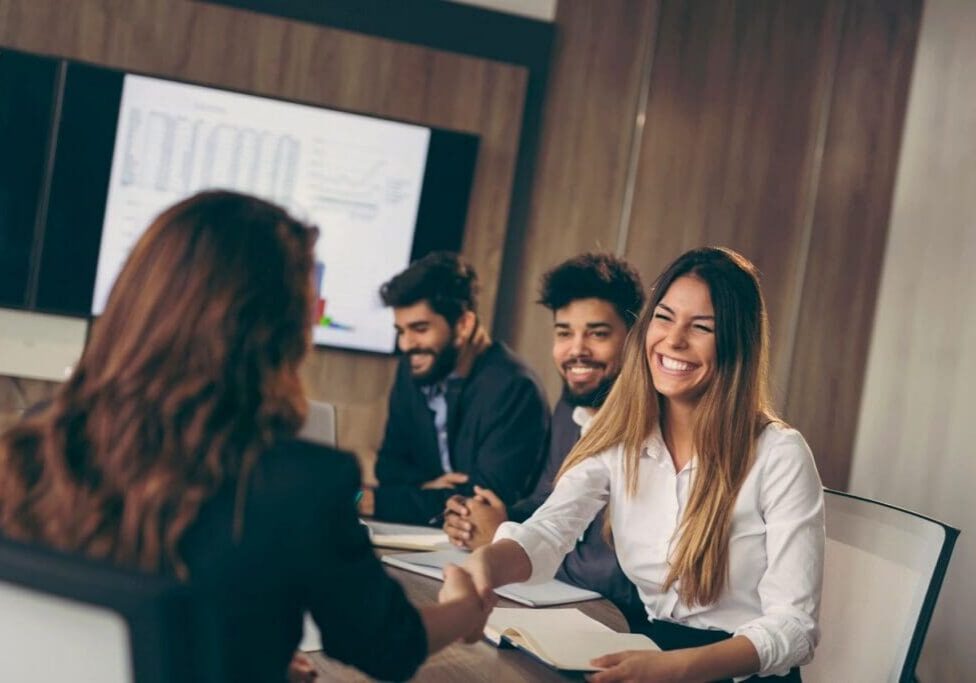 Professionals building workplace relationships through communication